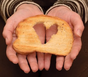 a heart cut out in a piece of toast