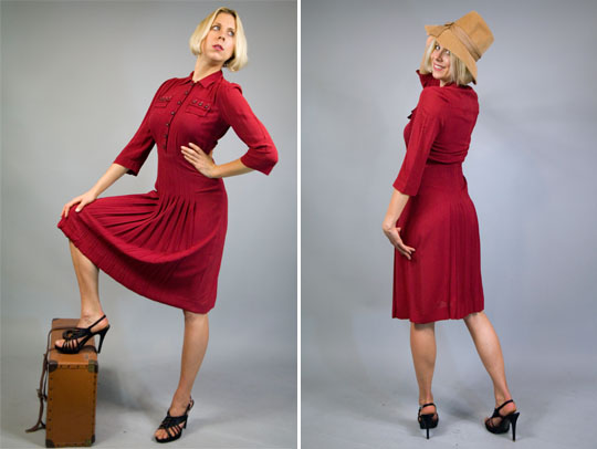 a model wearing a 1940s red military dress
