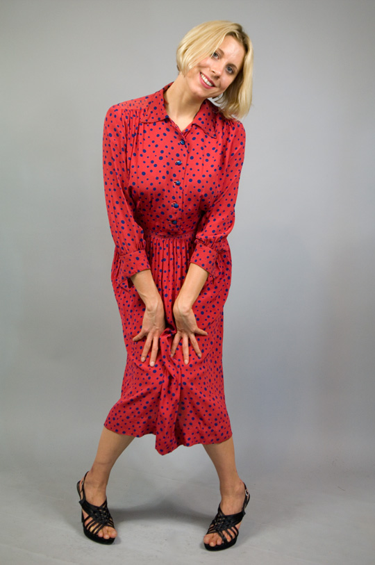 a 1940s rayon dress in a polka dot pattern on a red base