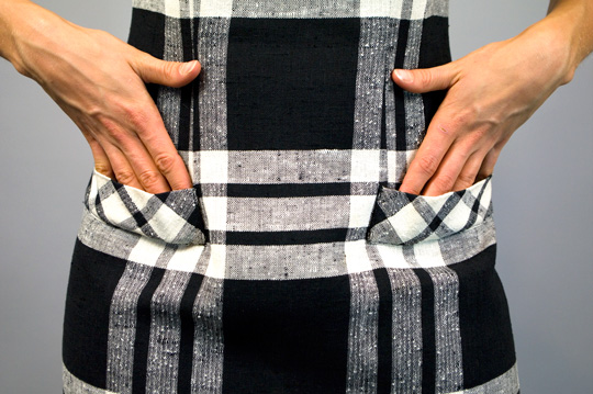 faux pockets on a 50s black and white plaid dress